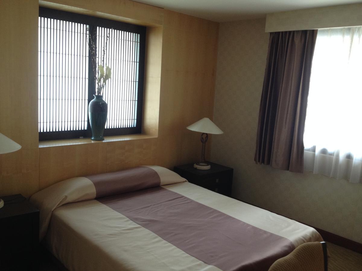 Gardengrove Suites Bangkok Zimmer foto